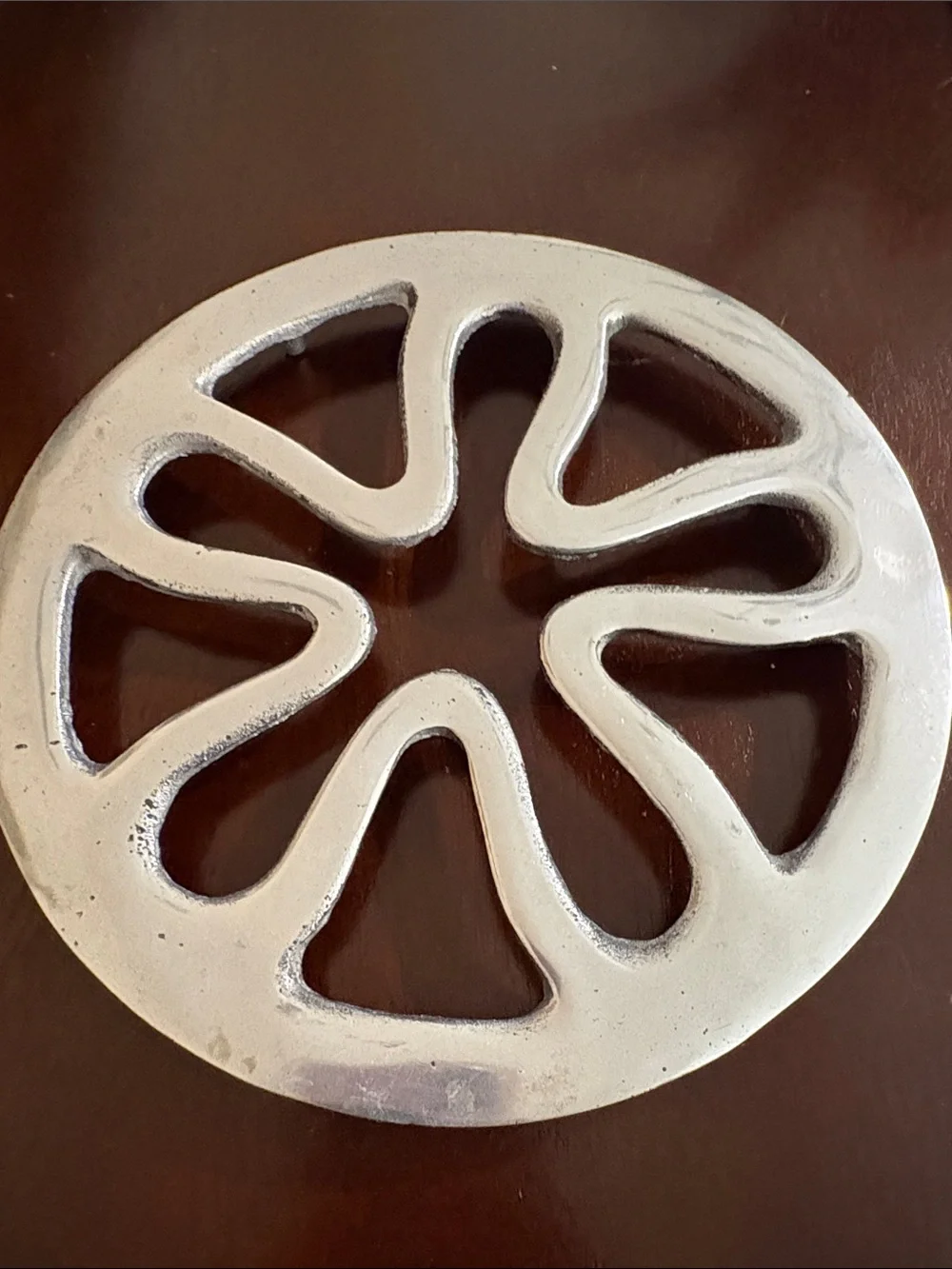 4 Peruvian Pewter setting plates to hold hot cookware